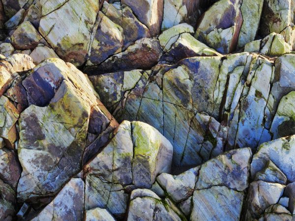 Image shows multi-coloured rock on Whitesands beach Pembrokeshire